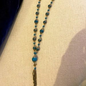 Pretty necklace with blue looking round pieces